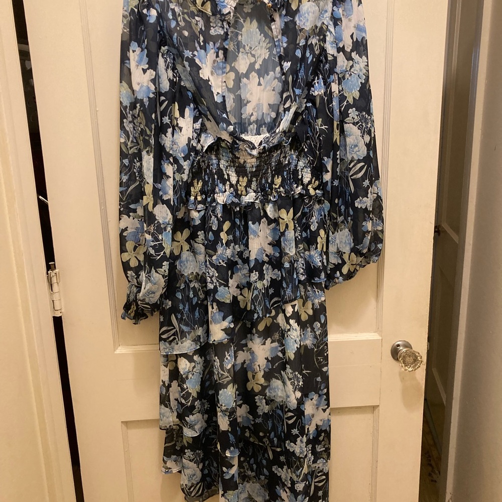 Floral dress with asymmetrical hemline and ruffled neckline